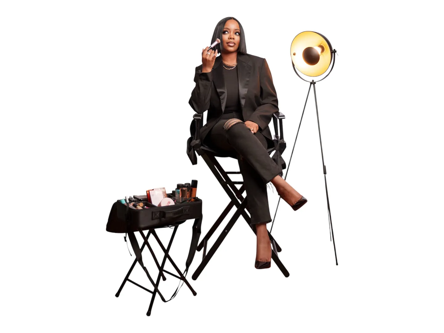 Keren in her studio corner: director's chair, open makeup case and studio light